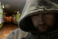 man in hooded sweatshirt