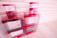 blurry coin-operated newspaper vending machines