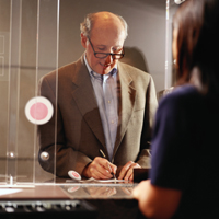 bank customer writing something down