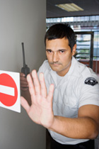 guard holding a radio