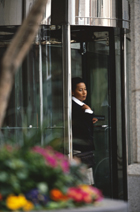 person standing in entrance to a bank