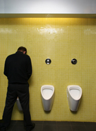 a person using a urinal