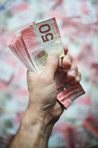 a stack of Canadian $50 bills