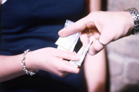 people exchanging drugs for money