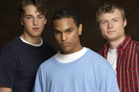 three people stand together