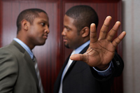 two people in suits talking
