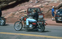 a person rides a motorcycle